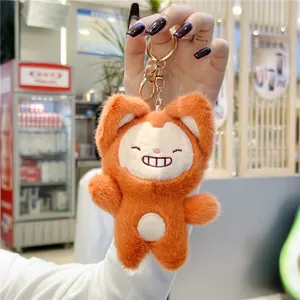 Detailed view of the cute orange cat plush pendant with a golden metal keyring