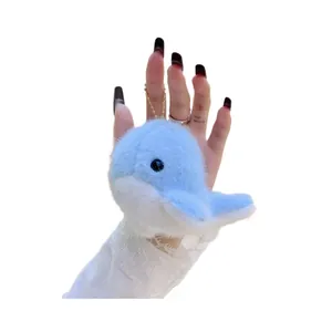 Cute light blue plush dolphin keychain with soft texture and golden metal chain link