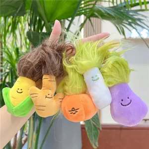 Detailed view of colorful vegetable plush keychains with long faux hair and smiley faces