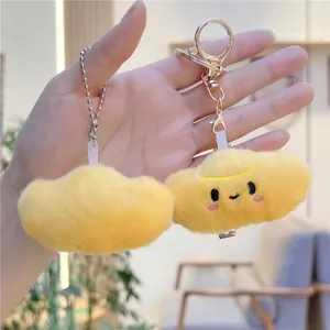 Cute yellow cloud plush keychain charms with smiling embroidery and soft fuzzy texture