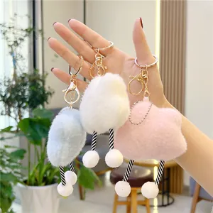 Cute plush cloud keychain set in blue, white, and pink with soft legs and gold metal clips