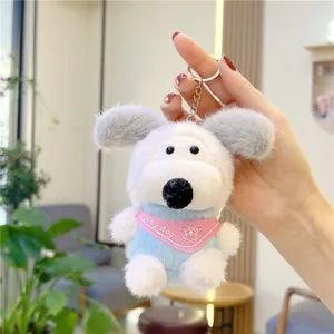 Detail of plush dog keychain featuring a pink scarf and silver metal lobster clasp