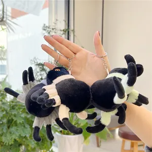 Plush spider keychain in black-white and black-green variants for bag decoration
