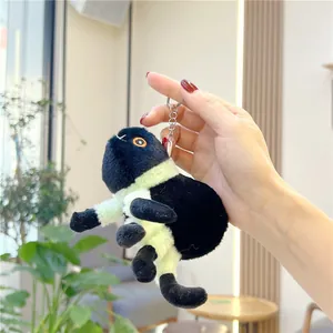 Plush black spider keychain with neon green accents and orange embroidered eyes