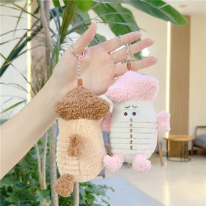 Cute plush cartoon doll keychain featuring textured fabric and soft aesthetic colors