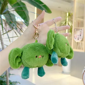 Cute green kelp knot plush toy keychain with soft fluffy texture and metal clasp