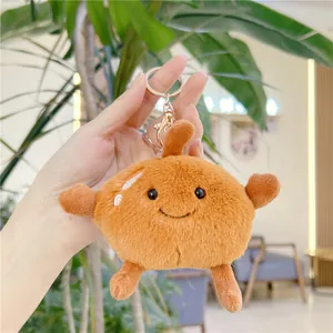 Cute brown plush pear keychain with a minimalist smile and golden metal lobster clasp