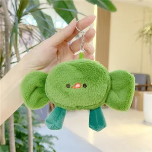Close-up of a cute green plush crab keychain accessory with silver metal ring