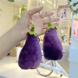 Plush purple eggplant keychains with smiling face embroidery and gold metal clip