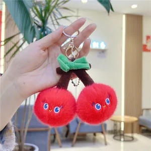 Creative plush cherry fruit keychain with cute embroidered face and green bow decoration