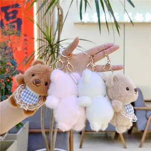 Set of four plush bear keychains in brown, pink, white and khaki with blue lace aprons