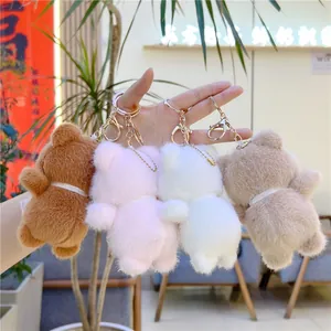 Set of four plush bear keychains in brown pink white and beige colors with gold rings