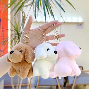 Cute plush dog keychains in brown, beige, and pink with golden metal lobster clasps