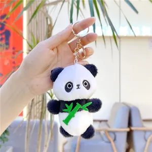 Cute plush panda keychain with green bamboo accessory and golden metal clasp