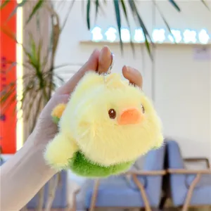 Porte-clés en peluche réversible représentant un poussin jaune doux au ventre vert