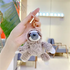 Cute brown plush sloth keychain with gold metal clasp for bags and gifts