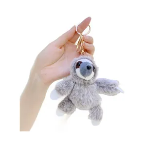 Cute gray and white sloth plush keychain with soft fur and golden metal lobster clasp