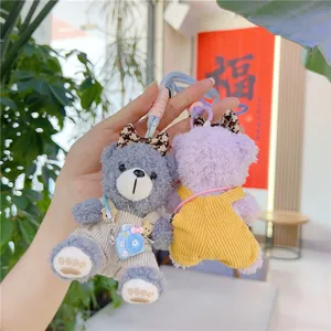 Cute teddy bear plush charms in blue and purple corduroy overalls for bags and keys