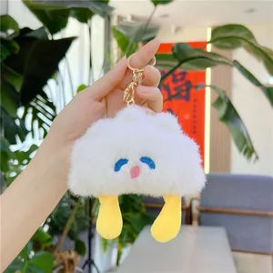 Cute white fluffy cloud plush keychain with yellow legs and gold metal clasp for bags