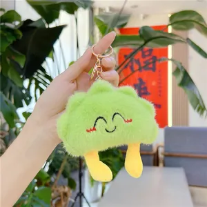 Handheld light green plush cloud keychain with cute smile and golden clasp detail