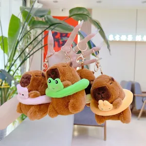 Three cute Capybara plush keychains with pig, frog, and duck swim rings on metal chains