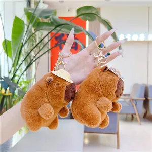 Adorabile portachiavi di peluche capibara con mini cappelli di paglia e clip dorata
