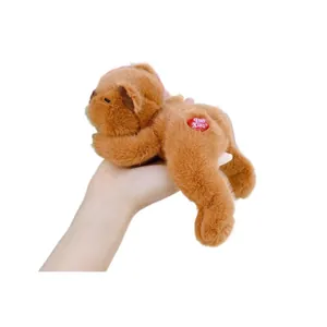 Palm-sized brown plush monkey with soft fur and a red heart tag on white background