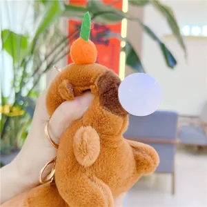 Cute Capybara plush keychain with a bubble blowing design and an orange head decoration
