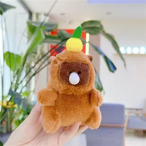 Close-up of cute capybara plush keychain with a bubble nose and lemon on head