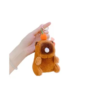 Cute plush capybara keychain with orange on head and bubble detail on white background