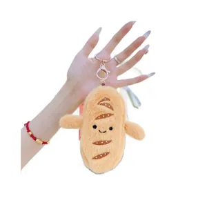 Porte-clés peluche baguette mignonne avec visage souriant et fermoir doré en métal