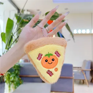 Cute plush pizza keychain with a cartoon face and metal clasp held in hand