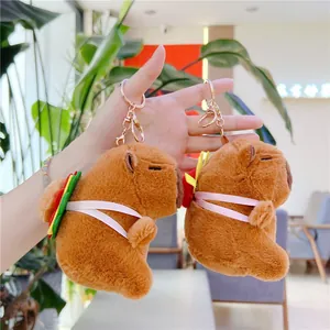Close-up of soft plush Capybara keychains with cute hamburger details and golden clips