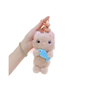 Plush cat keychain with blue fish decoration and golden metal ring for bags