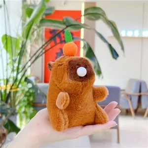 Detailed view of plush Capybara keychain with orange head accessory and cute bubble nose