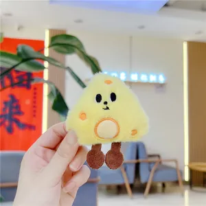 Detailed view of creative plush cheese keychain with embroidered holes and cute smiley face