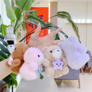 Cute plush bear keychains holding stars in brown, pink, beige and purple colors