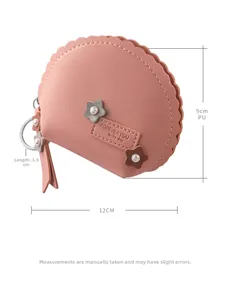 Mini billetera de cuero PU rosa con borla, amuleto floral y medida de 12x9x5,5 cm