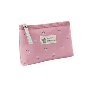 Petit sac en toile rose à fleurs avec étiquette Natural Style et tirette blanche