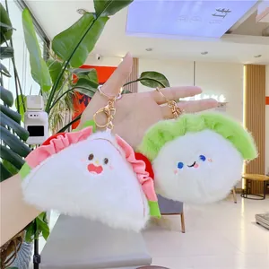Cute plush sushi and dumpling keychains with pink accents and golden lobster clasps