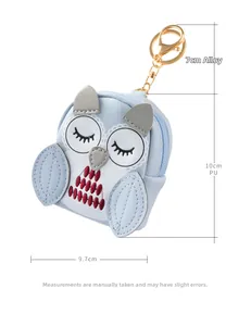 Macro view showing owl coin purse dimensions 10x9.7cm with a 7cm golden alloy clip