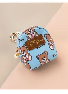 Detail of mini light blue bear coin purse with gold keychain and pearl pendant