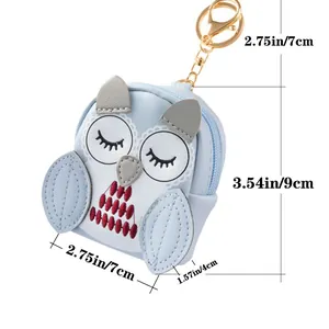 Light blue owl coin purse keychain with dimensions 9x7x4cm and gold metal clasp