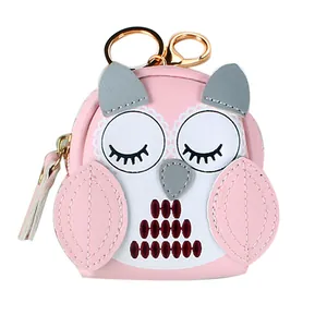 Cute pink owl coin purse keychain with golden ring and lobster clasp on white background