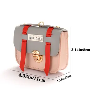 Mini faux leather coin purse in grey and pink with gold hardware and delicate label
