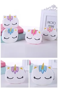 Detail of plush unicorn coin purse with gold glitter horn and secure metal chain