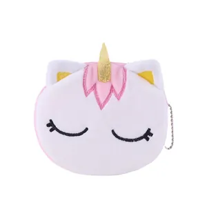 Cute plush unicorn coin purse with pink white fur and golden horn keychain detail