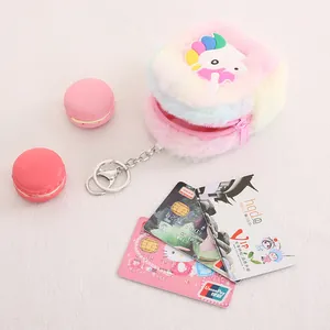 Rainbow unicorn plush coin purse with colorful silicone horn and a pink zipper closure