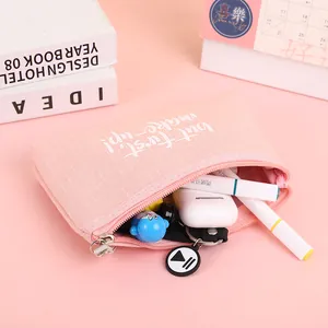 Pink canvas makeup pouch with zipper and 'but first, make-up' text for small items