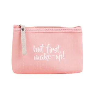 Pink striped cosmetic bag with 'but first, make-up!' text and white zipper puller